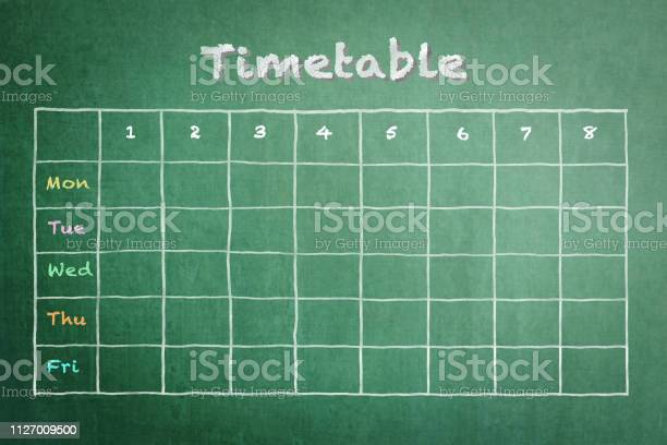 School timetable on green chalkboard background