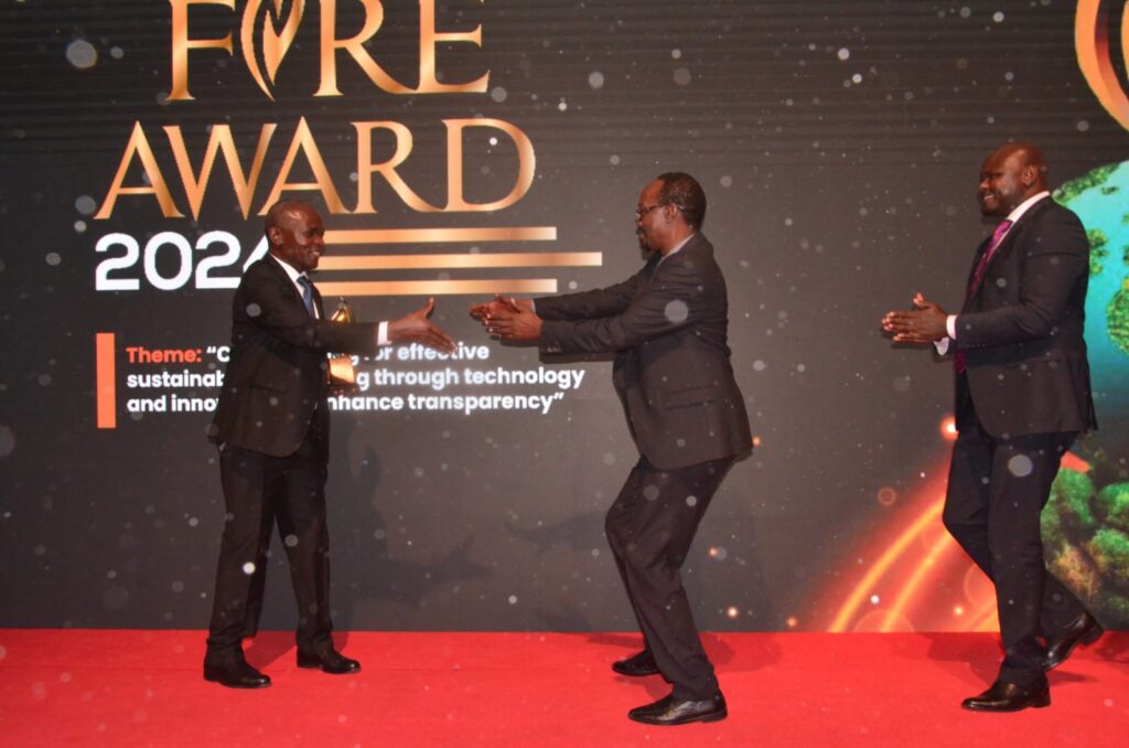 fire 4 The TUC Principal Prof. George Chemining'wa receiving the 2024 FiRe Award trophy