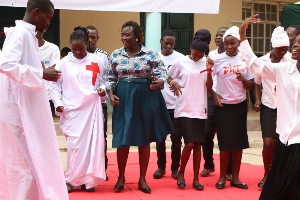 culture f CECM Ministry of Tourism, Culture, and Natural Resources, Turkana County, Hon. Leah Audan Lokaala, dancing to a Luo sacred song during the cultural festival