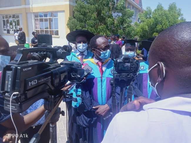 Graduation procession in academic regalia